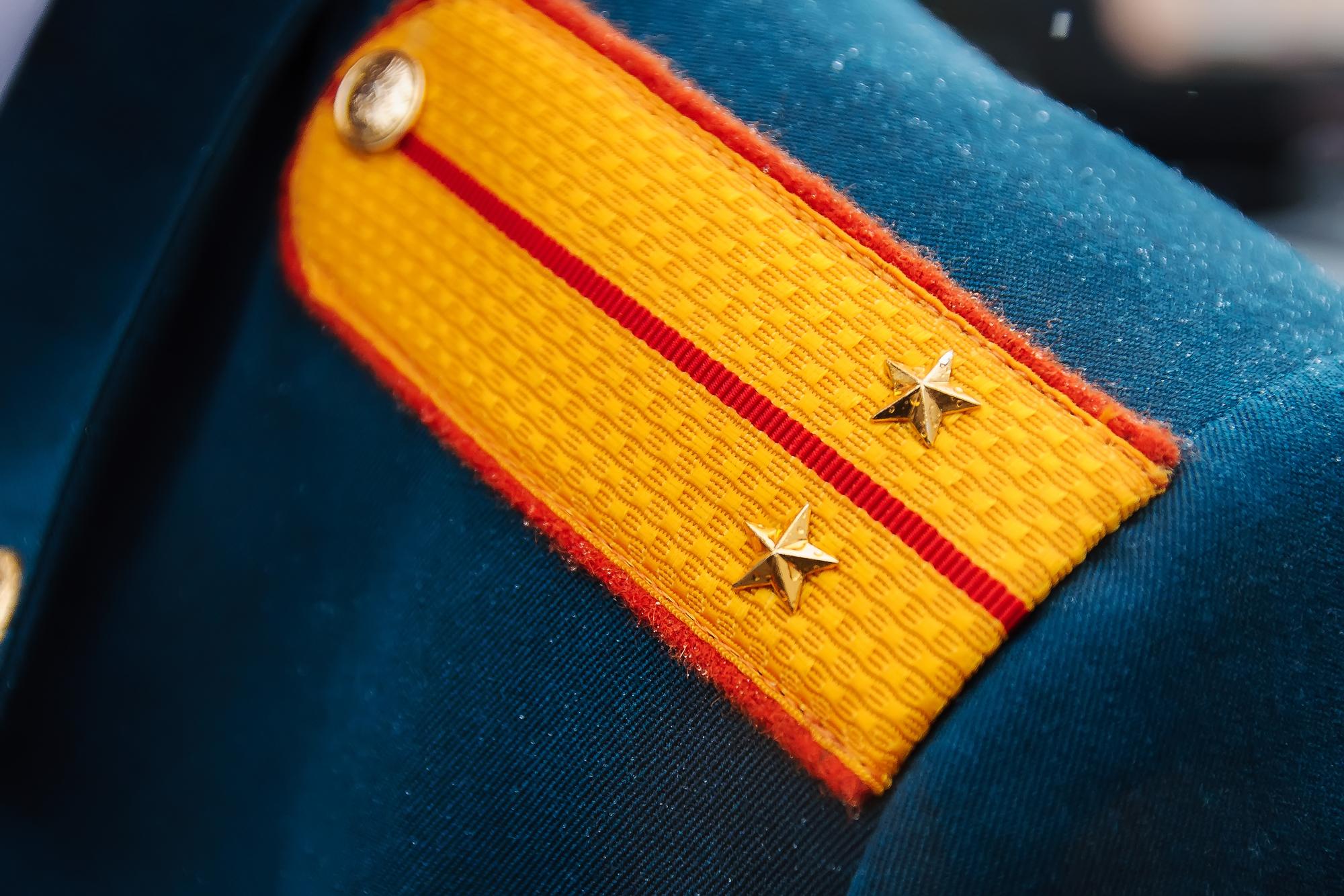 embroidered badge on jacket lapel